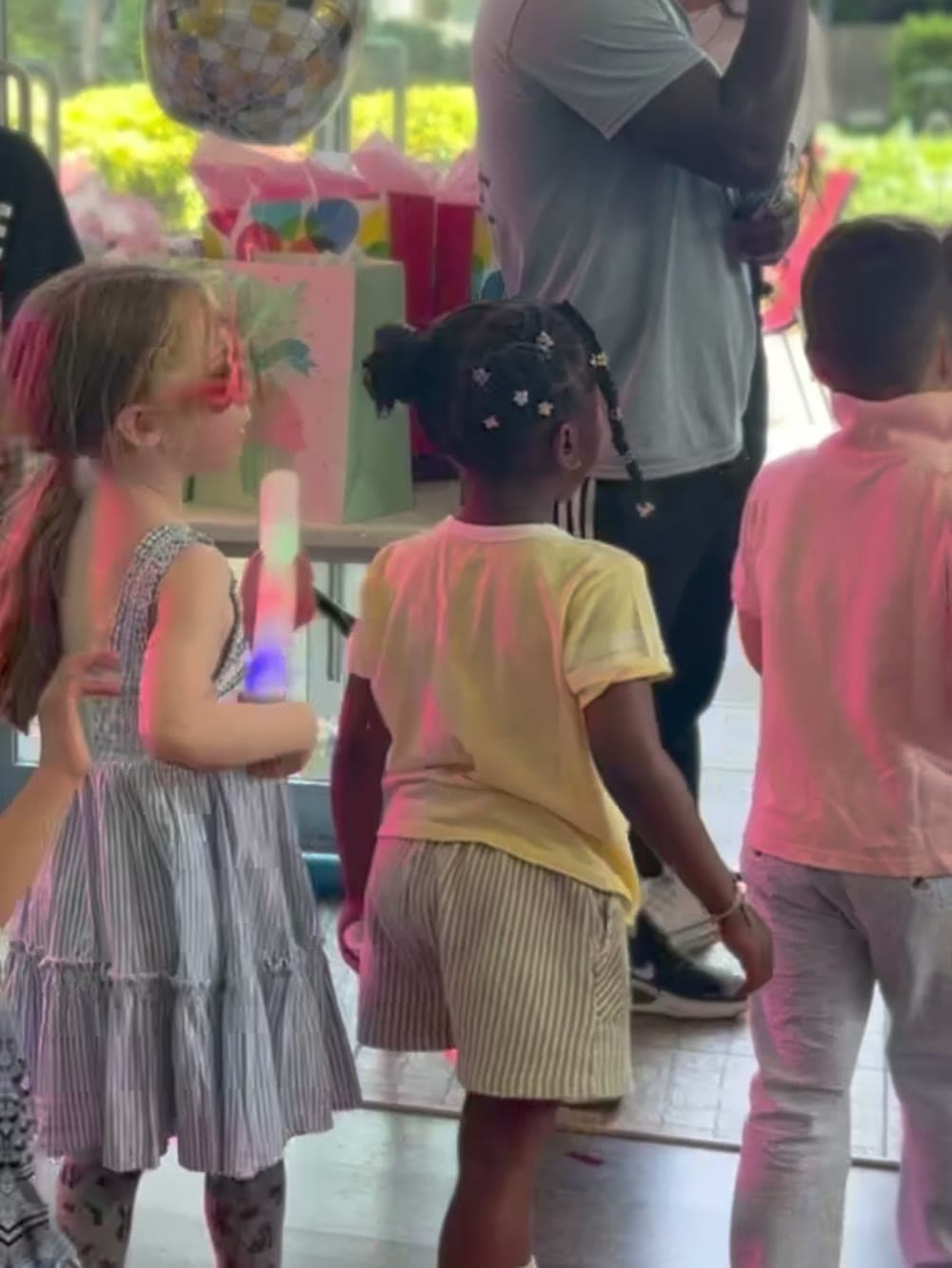Kids dancing together with glow sticks at a Vancouver girls birthday party.